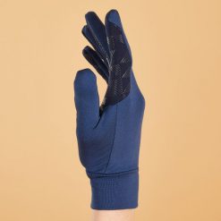 Rękawiczki jeździeckie dla dzieci Fouganza 100. Niebieskie rękawiczki dziecięce FOUGANZA, z dzianiny, bez ramiączek. Za 29.99 zł.