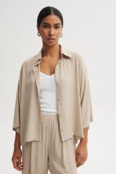 KOSZULA MEL PIASKOWA M - Flawless. Koszule damskie Flawless, m, bez wzorów, z materiału, klasyczne, bez kołnierzyka, bez ramiączek. Za 337.45 zł.