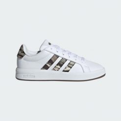 Adidas Junior KI5695 Biały - Tenisówki lifestyle. Białe trampki i tenisówki męskie Adidas, bez wzorów, z materiału, bez zapięcia. Za 160.99 zł.