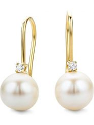 Revoni Złote kolczyki z diamentami i perłami rozmiar: onesize. Białe kolczyki damskie Revoni, z diamentem, złote, z zapięciem typu bigiel. Za 1,609.99 zł.