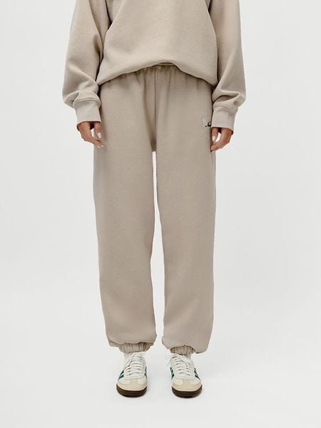 LeGer Spodnie dresowe "Maxime" w kolorze beżowym rozmiar: 38. Brązowe spodnie dresowe damskie LeGer, bez wzorów, z dresówki. Za 101.94 zł.