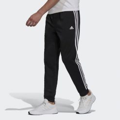 Spodnie męskie adidas Primegreen Essentials Warm-Up Tapered 3-Stripes Track. Białe spodnie dresowe męskie Adidas, z dresówki. Za 182.00 zł.
