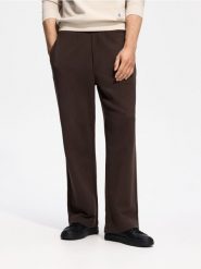 Spodnie baggy - brązowy. Brązowe spodnie materiałowe męskie Reserved, bez wzorów, z bawełny. Za 129.99 zł.