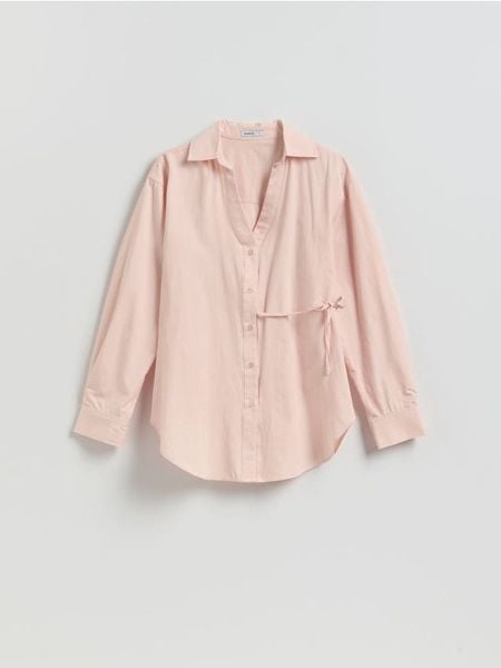 Bawełniana koszula z wiązaniem - brzoskwiniowy. Pomarańczowe koszule damskie Reserved, l, bez wzorów, z bawełny, bez kołnierzyka, bez ramiączek. Za 109.99 zł.