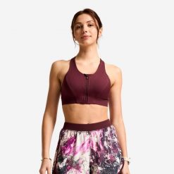 Stanik sportowy. Fioletowe biustonosze sportowe damskie Decathlon, bez wzorów, z elastanu. Za 119.99 zł.
