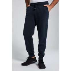 Męskie Spodnie dresowe ściągane sznurkiem nowoczesny krój do roz. 8XL. Niebieskie spodnie dresowe męskie JAY-PI, bez wzorów, z bawełny. Za 239.99 zł.