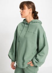 Bluza z kapturem oversized, z miękkiego materiału z bawełną. Zielone bluzy z kapturem damskie bonprix, z bawełny. Za 99.99 zł.