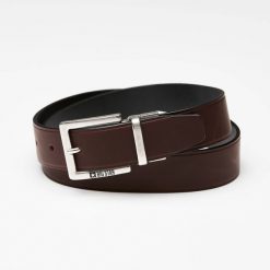 Pasek męski Big Star, naturalna skóra licowa w ciemnobrązowym kolorze z metalową klamrą o matowym wykończeniu oraz klasyczną szerokością do codzienne. Brązowe paski męskie Big Star Accessories, bez wzorów, ze skóry, eleganckie. Za 139.00 zł.