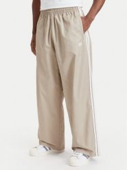 Adidas Spodnie dresowe Adicolor Sst Cotton Twill Trousers KR1385 Beżowy Relaxed Fit. Brązowe spodnie dresowe męskie Adidas, bez wzorów, z bawełny. Za 349.99 zł.