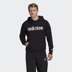 Bluza męska adidas Essentials French Terry Linear Logo Hoodie. Białe bluzy sportowe męskie Adidas, bez wzorów, sportowe, bez kołnierzyka, bez ramiączek. Za 182.00 zł.