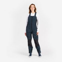 Spodnie żeglarskie damskie Tribord 500 na szelkach. Czarne spodnie dresowe damskie TRIBORD, bez wzorów, z polaru, sportowe. Za 519.99 zł.
