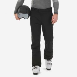 Spodnie narciarskie i snowboardowe męskie Quechua 500 softshell. Czarne spodnie materiałowe męskie WED'ZE, bez wzorów, z materiału, sportowe. Za 279.99 zł.