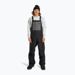 Spodnie snowboardowe męskie DC Docile Bib. Czarne spodnie materiałowe męskie DC Shoes, bez wzorów, sportowe. Za 609.99 zł.