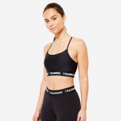 Stanik sportowy Decathlon. Czarne biustonosze sportowe damskie DOMYOS, bez wzorów, z elastanu. Za 49.99 zł.