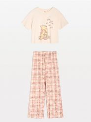 Bawełniana piżama dwuczęściowa Winnie the Pooh - kremowy. Białe piżamy damskie Sinsay, l, bez wzorów, z bawełny, bez ramiączek. Za 59.99 zł.