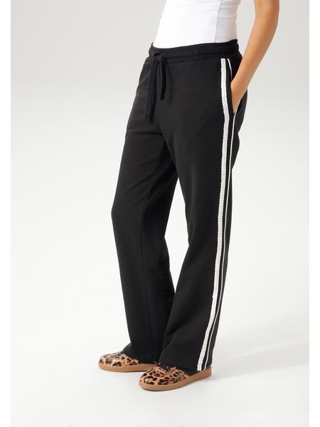 Aniston Spodnie dresowe w kolorze czarnym rozmiar: 48. Czarne spodnie dresowe damskie Aniston, bez wzorów, z dresówki. Za 61.02 zł.