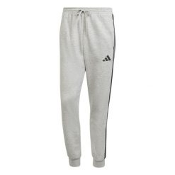 Spodnie do biegania adidas Essentials 3-Stripes Fleece. Czarne spodnie materiałowe męskie Adidas, bez wzorów, z bawełny, sportowe. Za 218.70 zł.