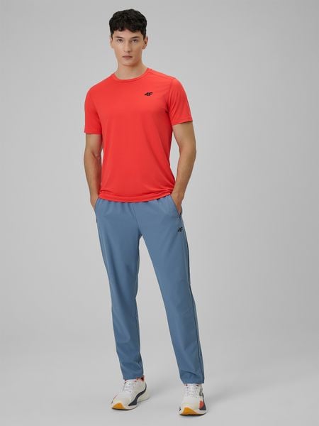 4F Spodnie treningowe szybkoschnące męskie - granatowe S. Niebieskie spodnie materiałowe męskie 4f, bez wzorów, z materiału. Za 179.99 zł.