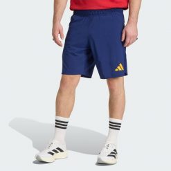 Szorty Hiszpania Tiro Travel. Niebieskie szorty męskie Adidas, bez wzorów, sportowe. Za 219.00 zł.