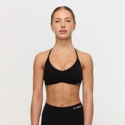 Biustonosz damski fitness ze skrzyżowanymi ramiączkami czarny Fierce. Czarne biustonosze sportowe damskie GYMBEAM, bez wzorów, z elastanu. Za 84.90 zł.