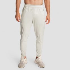 Spodnie męskie do biegania slim szare Pulse X. Szare spodnie materiałowe męskie GYMBEAM, bez wzorów, z elastanu, sportowe. Za 127.90 zł.
