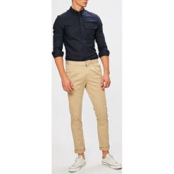 Calvin Klein Jeans - Spodnie. Szare spodnie materiałowe męskie Calvin Klein Jeans, bez wzorów, z bawełny, casualowe. W wyprzedaży za 319.90 zł.