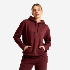 Bluza z kapturem damska Essential. Fioletowe bluzy sportowe damskie Decathlon, l, bez wzorów, z materiału, bez ramiączek, z kapturem. Za 89.99 zł.