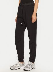Champion Spodnie dresowe 117477 Czarny Slim Fit. Czarne spodnie dresowe damskie CHAMPION, s, bez wzorów, z dresówki. Za 199.99 zł.