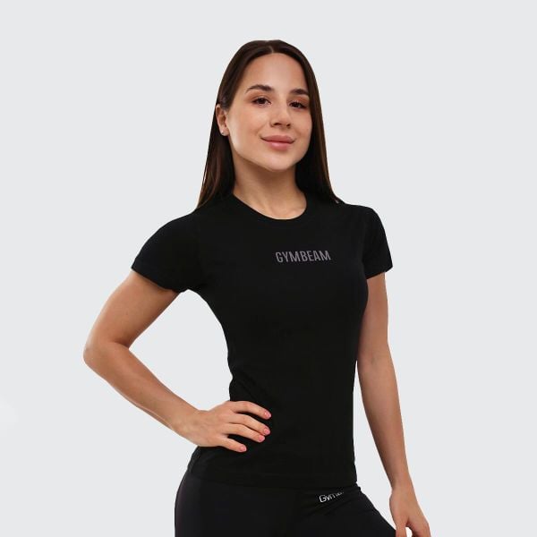 Koszulka damska fitness slim fit czarna FIT. Czarne bluzki sportowe damskie GYMBEAM, m, bez wzorów, z bawełny, bez kołnierzyka. Za 66.90 zł.