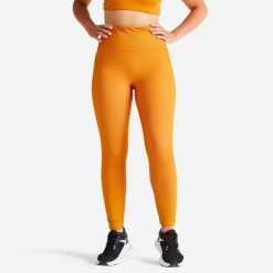 Legginsy fitness damskie Domyos. Brązowe legginsy damskie DOMYOS, l, bez wzorów, z materiału. Za 69.99 zł.