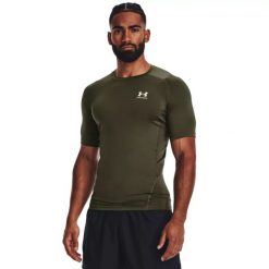 Under Armour UA HG ARMOUR COMP SS Koszulka treningowa męska. Szare t-shirty sportowe męskie Under Armour, m, z materiału, bez ramiączek, na fitness i siłownię. Za 109.99 zł.