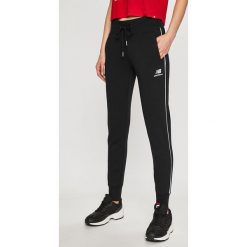 New Balance - Spodnie sportowe. Czarne spodnie sportowe damskie New Balance, l, z bawełny. W wyprzedaży za 159.90 zł.