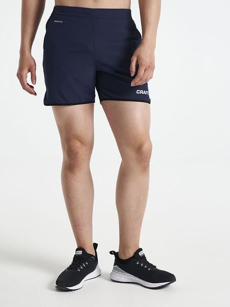 Craft Szorty sportowe "Pro Control Impact" w kolorze granatowym rozmiar: XL. Niebieskie szorty męskie Craft, bez wzorów, z materiału, sportowe. Za 121.35 zł.