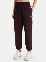 Calvin Klein Jeans Spodnie dresowe Monologo LV047B235G Brązowy Regular Fit. Brązowe jeansy damskie Calvin Klein Jeans, m, bez wzorów, z bawełny. Za 309.99 zł.