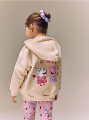 Bluza z kapturem Świnka Peppa - kremowy. Białe bluzy i bluzki niemowlęce Reserved, bez wzorów, z bawełny, bez ramiączek, z kapturem. Za 59.99 zł.