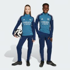 Spodnie treningowe Arsenal Tiro 25 Competition. Niebieskie spodnie dresowe damskie Adidas, z dresówki, na fitness i siłownię. Za 259.00 zł.