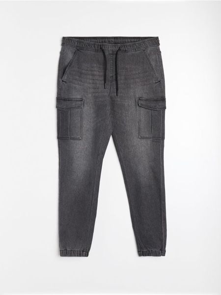 Jeansy jogger cargo z efektem sprania - szary. Szare jeansy męskie Sinsay. Za 69.99 zł.
