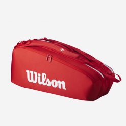 Torba tenisowa Wilson Super Tour 6R. Czerwone torebki klasyczne damskie Wilson, bez wzorów, duże, bez dodatków. Za 449.99 zł.