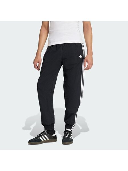 Adidas Spodnie dresowe Firebird Woven KE1371 Czarny Regular Fit. Czarne spodnie dresowe męskie Adidas, bez wzorów, z dresówki. Za 228.99 zł.