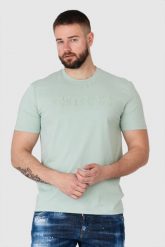 GUESS Pistacjowy t-shirt męski z wytłaczanym logo. Zielone t-shirty męskie Guess, m, z aplikacjami, bez kołnierzyka. W wyprzedaży za 109.99 zł.