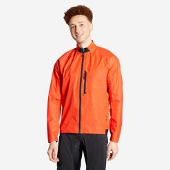 Kurtka przeciwdeszczowa rowerowa MTB Rockrider Comfort 500. Czerwone kurtki damskie ROCKRIDER, l, bez wzorów, z materiału, rowerowe. Za 159.99 zł.