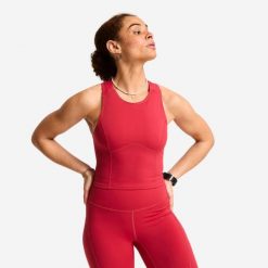 Koszulka fitness damska Domyos bez rękawów. Czerwone bluzki sportowe damskie DOMYOS, l, z elastanu, bez kołnierzyka, bez ramiączek. Za 69.99 zł.