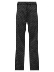 Guess Spodnie dresowe Z5BB07 K2042 Czarny Regular Fit. Czarne spodnie dresowe męskie Guess, z aplikacjami, z dresówki. Za 524.99 zł.