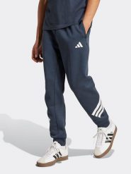 Adidas Spodnie dresowe w kolorze granatowym rozmiar: M. Niebieskie spodnie dresowe męskie Adidas, bez wzorów, z dresówki. Za 226.77 zł.