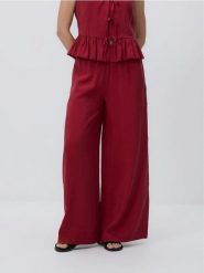 Szerokie spodnie z modalem - bordowy. Czerwone spodnie materiałowe damskie Reserved, bez wzorów, z tkaniny. Za 119.99 zł.