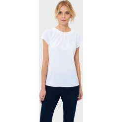 Bluzka z ozdobnymi koralikami. Bluzki damskie Greenpoint, bez wzorów, z poliesteru, bez kołnierzyka, bez ramiączek. Za 49.99 zł.