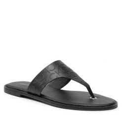 Japonki Calvin Klein. Czarne klapki damskie CALVIN KLEIN, bez wzorów, bez obcasa. Za 599.99 zł.