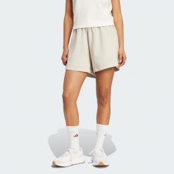 Luźne szorty Soft Lux. Brązowe spodenki sportowe damskie Adidas, bez wzorów, sportowe. Za 219.00 zł.