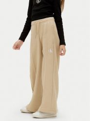 Calvin Klein Jeans Spodnie dresowe IG0IG02875 M Beżowy Wide Leg. Brązowe spodnie dziewczęce Calvin Klein Jeans, z bawełny. Za 179.99 zł.