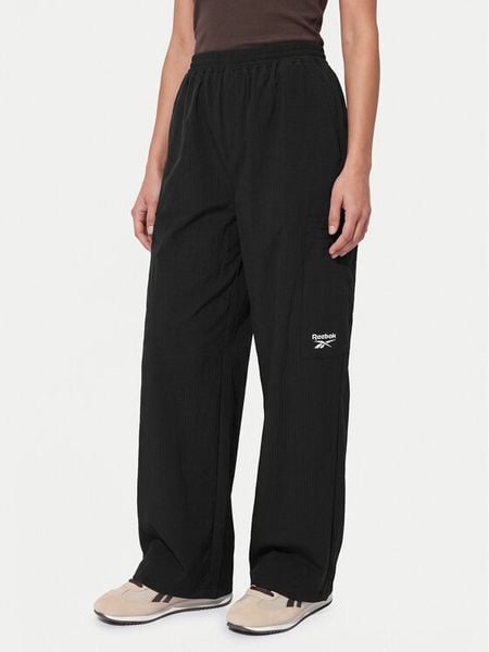 Reebok Spodnie dresowe Zofia RK25679CCW Czarny Relaxed Fit. Czarne spodnie dresowe damskie Reebok, xl, bez wzorów, z dresówki. Za 296.99 zł.